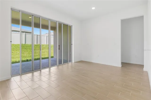 a view of an empty room with a sliding door