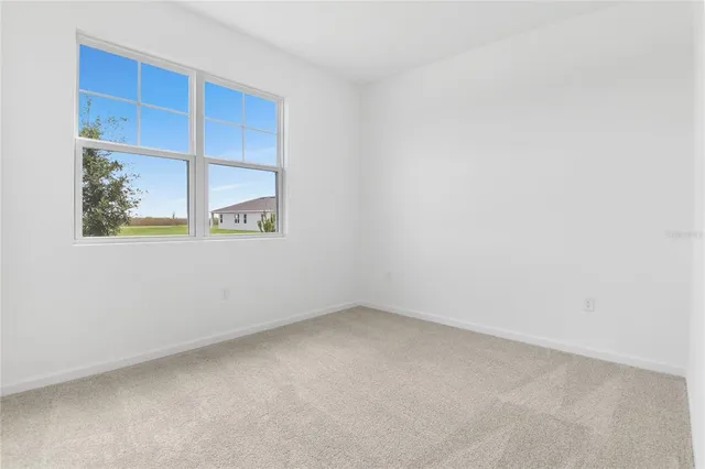 a view of room with window and cabinet