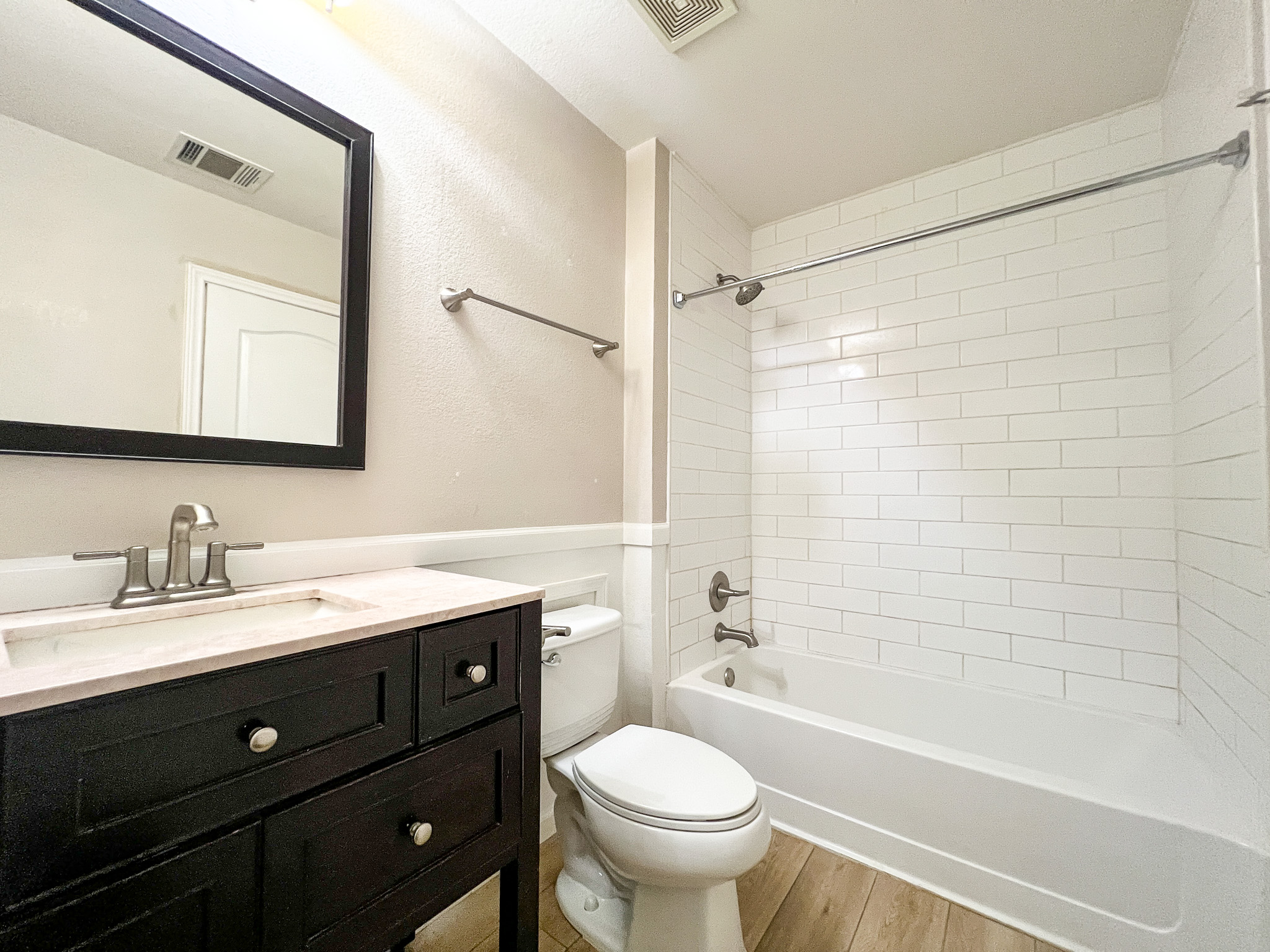 298 Jack Rabbit Lane Buda, TX 78610 - Photo 13 of 24 A well-appointed bathroom featuring subway tile and a sleek vanity for daily routines.