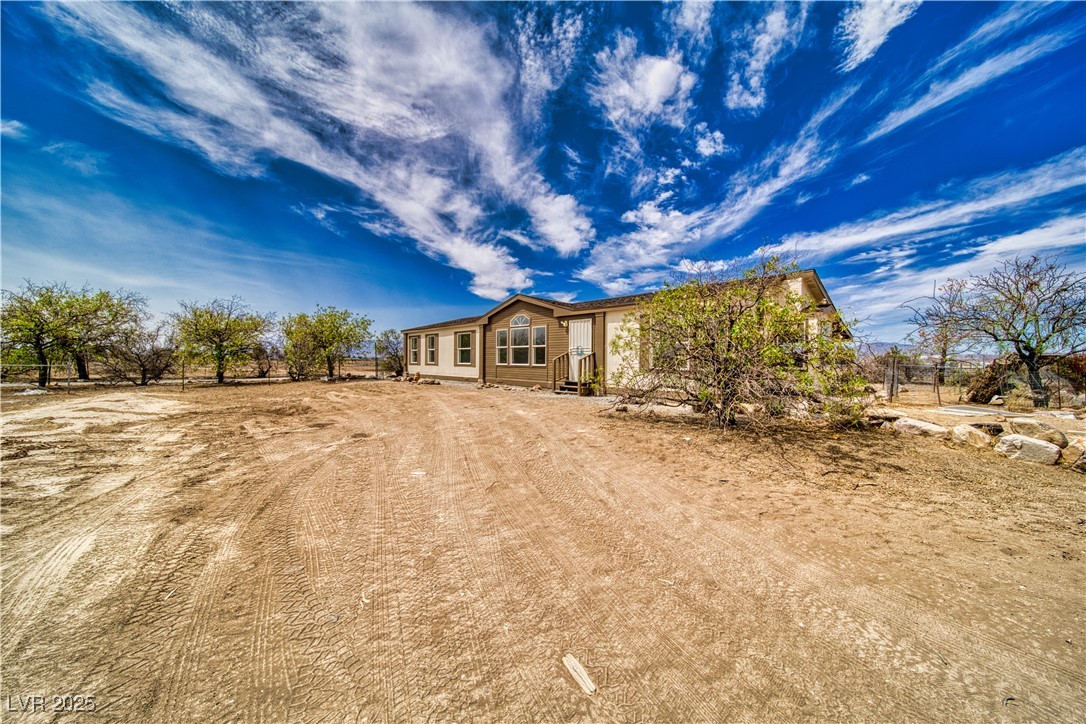 1340 South Adams Road Pahrump, NV 89048 - Photo 31 of 31 View of front of home featuring driveway