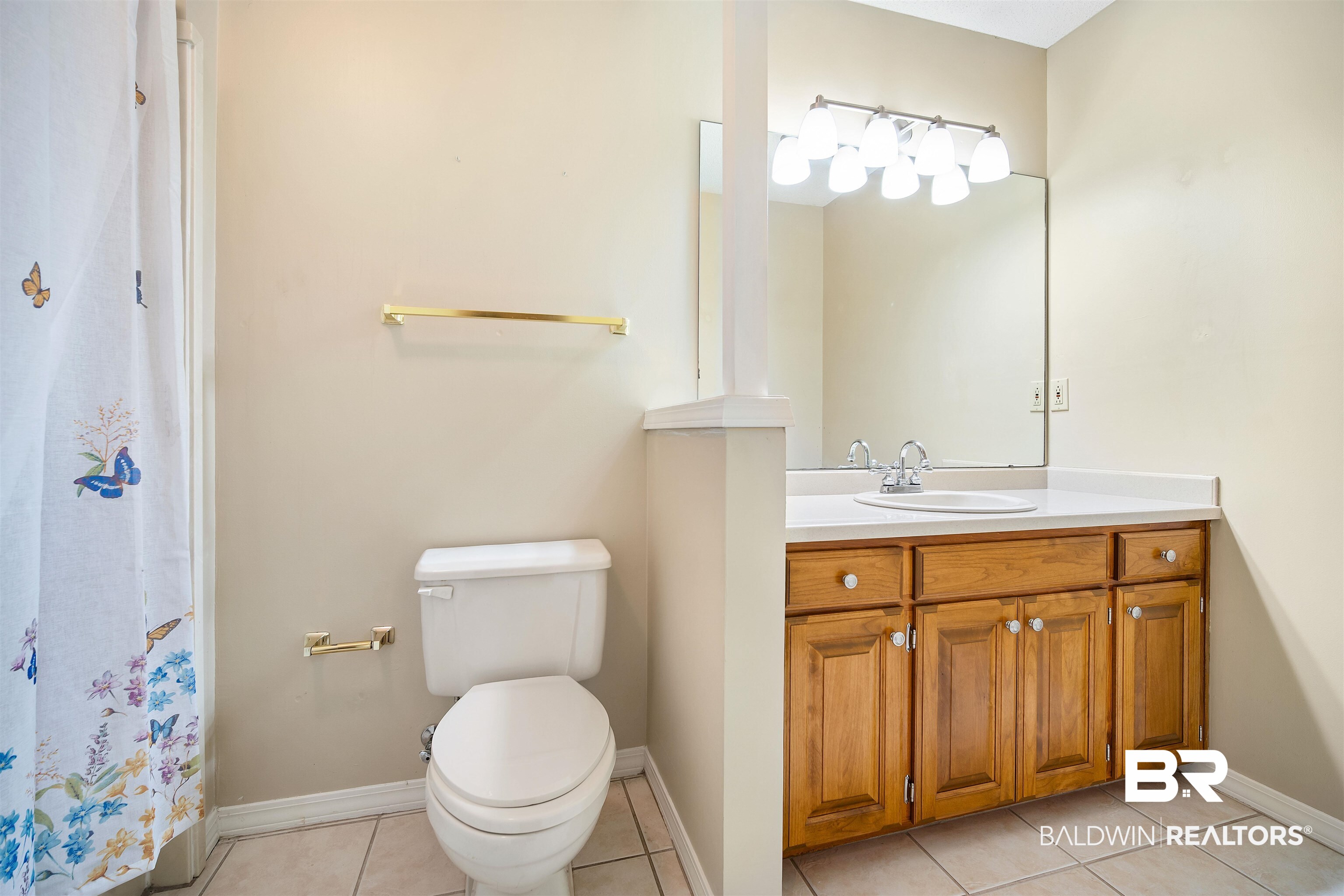 7100 Huntington Court South Mobile, AL 36619 - Photo 25 of 30 Bathroom featuring toilet, vanity, and tile patterned floors