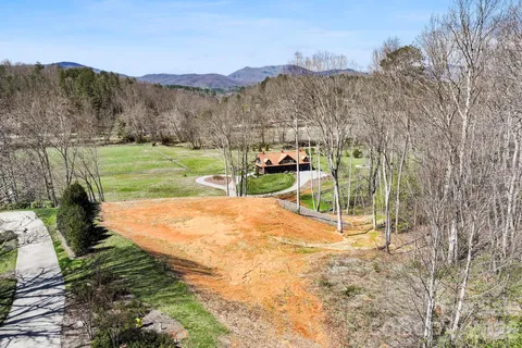 a view of a park with large trees