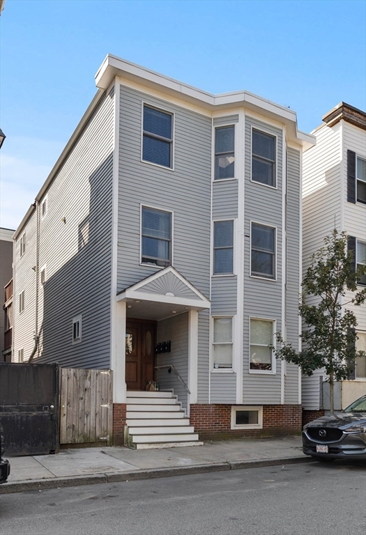 843 East 2nd Street, Unit 2 Boston, MA 02127 - Photo 2 of 12 a front view of a building with a road