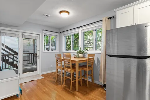 a view of a dining room with furniture window and outside view