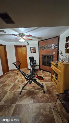 a room with gym equipment and a table