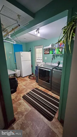 a bedroom with a bed and a television