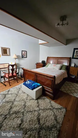 a bedroom with furniture window and a potted plant