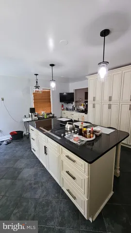a kitchen with a stove and a sink
