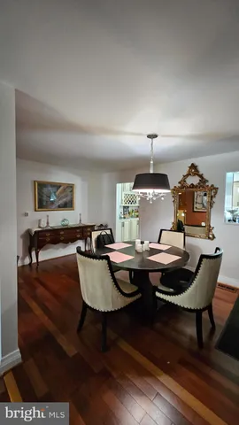 a living room with furniture a window and a table