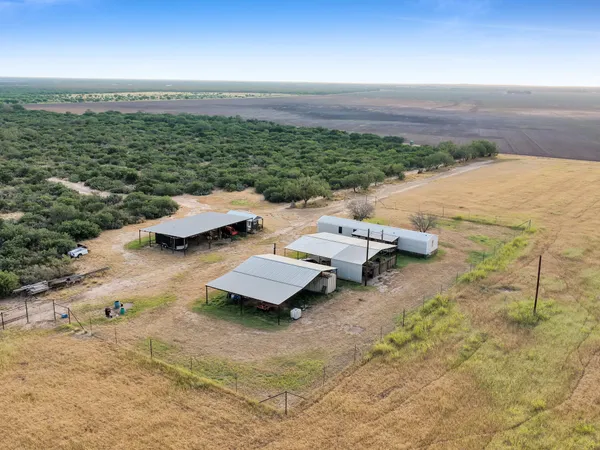 an aerial view of house with yard