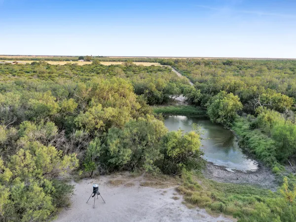 a view of a lake with a yard