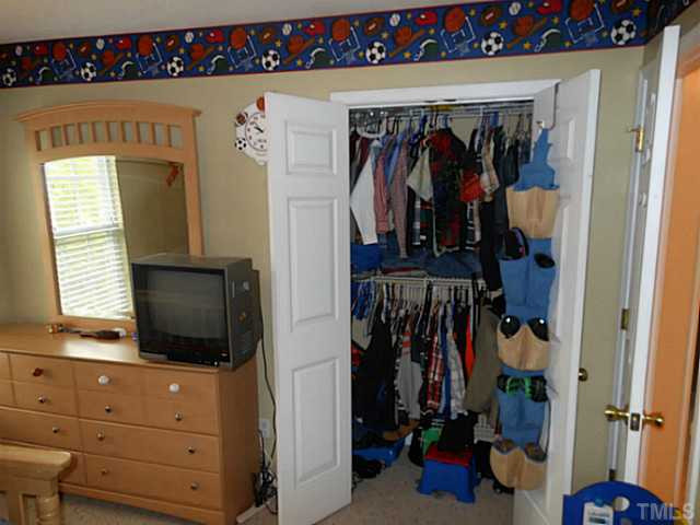 1 Edgebrook Circle Durham, NC 27703 - Photo 17 of 24 a view of walk in closet with clothes