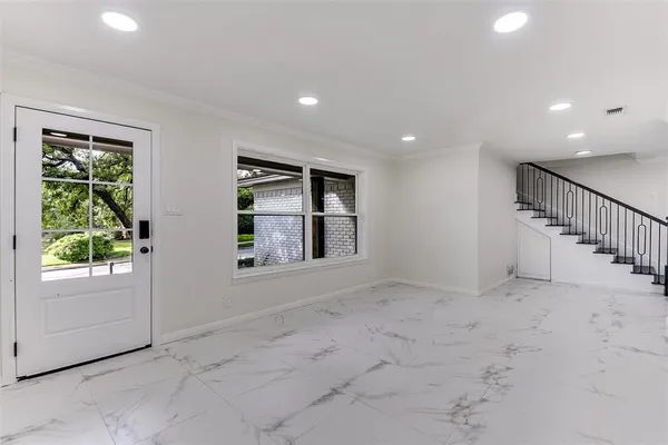 a view of an empty room with a window