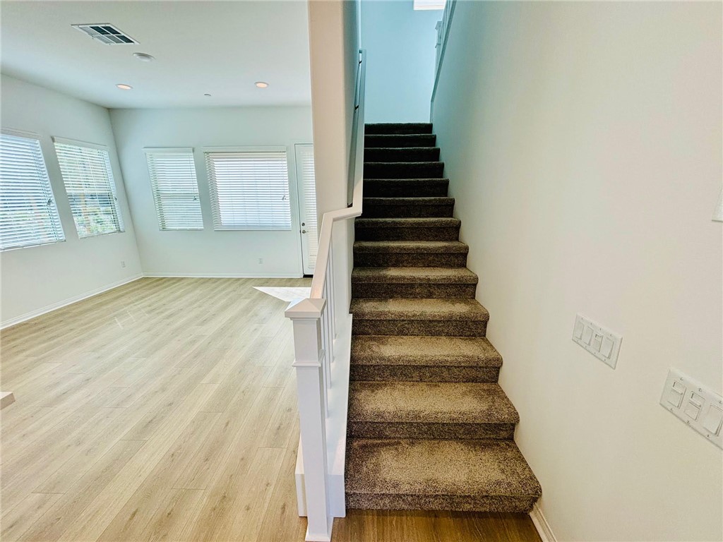 27366 Hyland Newhall, CA 91321 - Photo 11 of 31 a view of entryway and hall with wooden floor