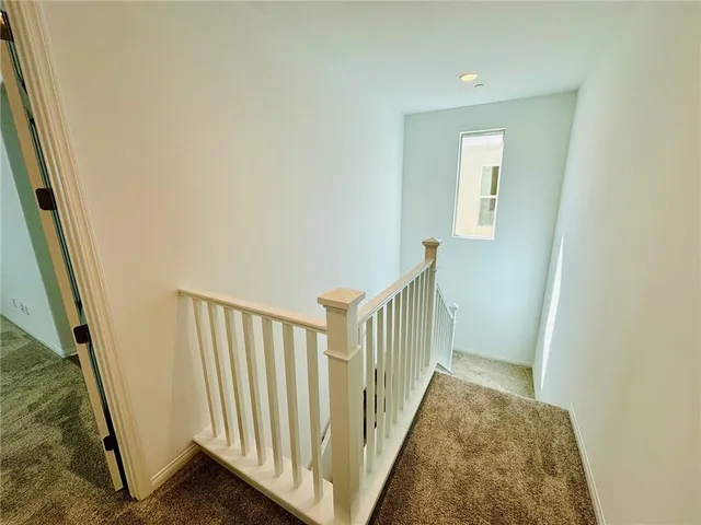 a view of a hallway with a door