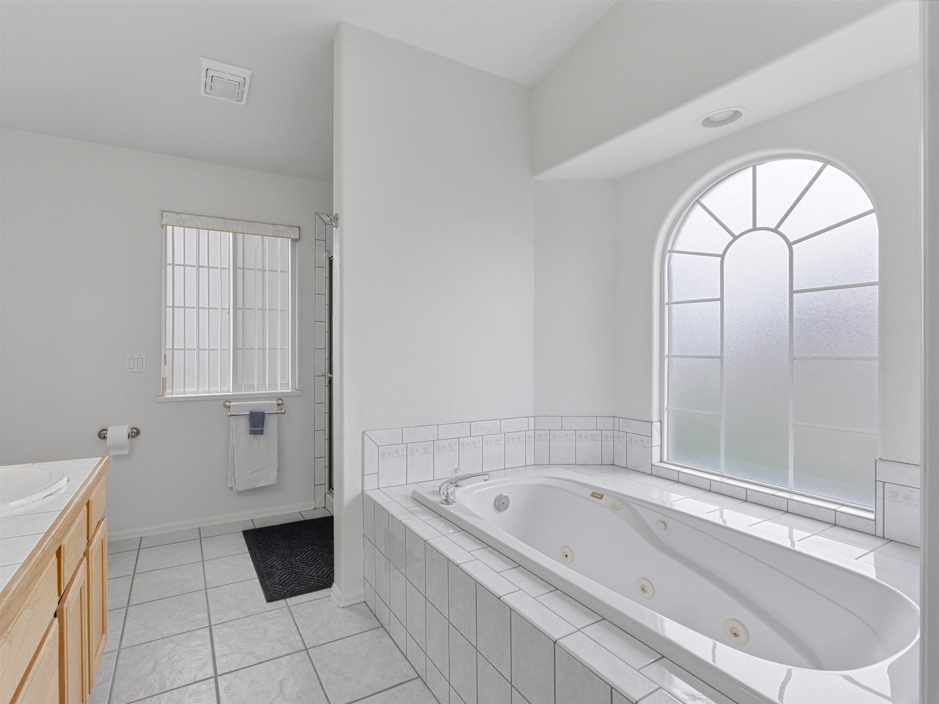 3082 Shadowbrook Court Grand Junction, CO 81504 - Photo 16 of 28 a bathroom with a bathtub and a shower