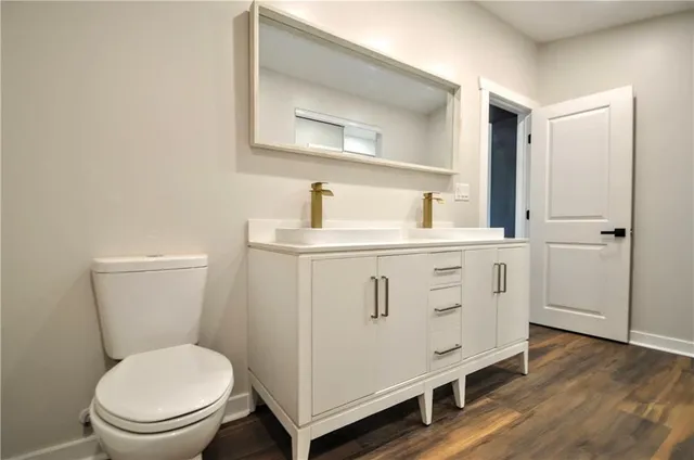 a view of a room with wooden floor