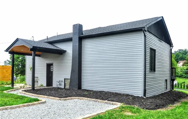 a front view of a house with garden