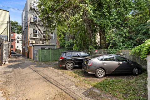 a view of a car parked in front of a house
