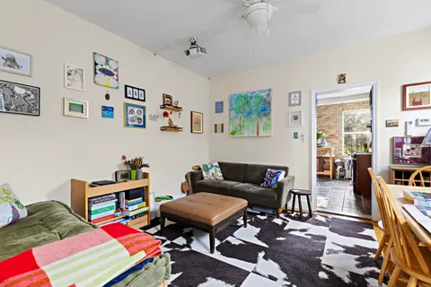 a living room with furniture and a rug