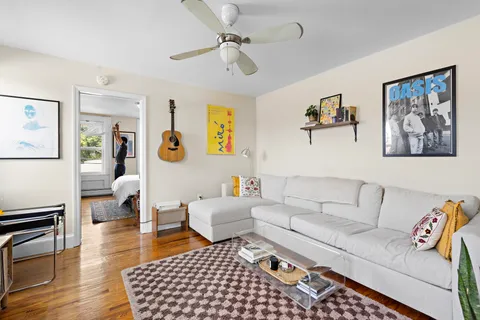 a living room with furniture and a rug