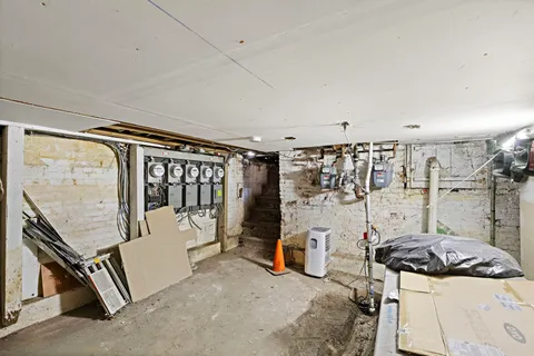 a view of a hallway with furniture and entryway