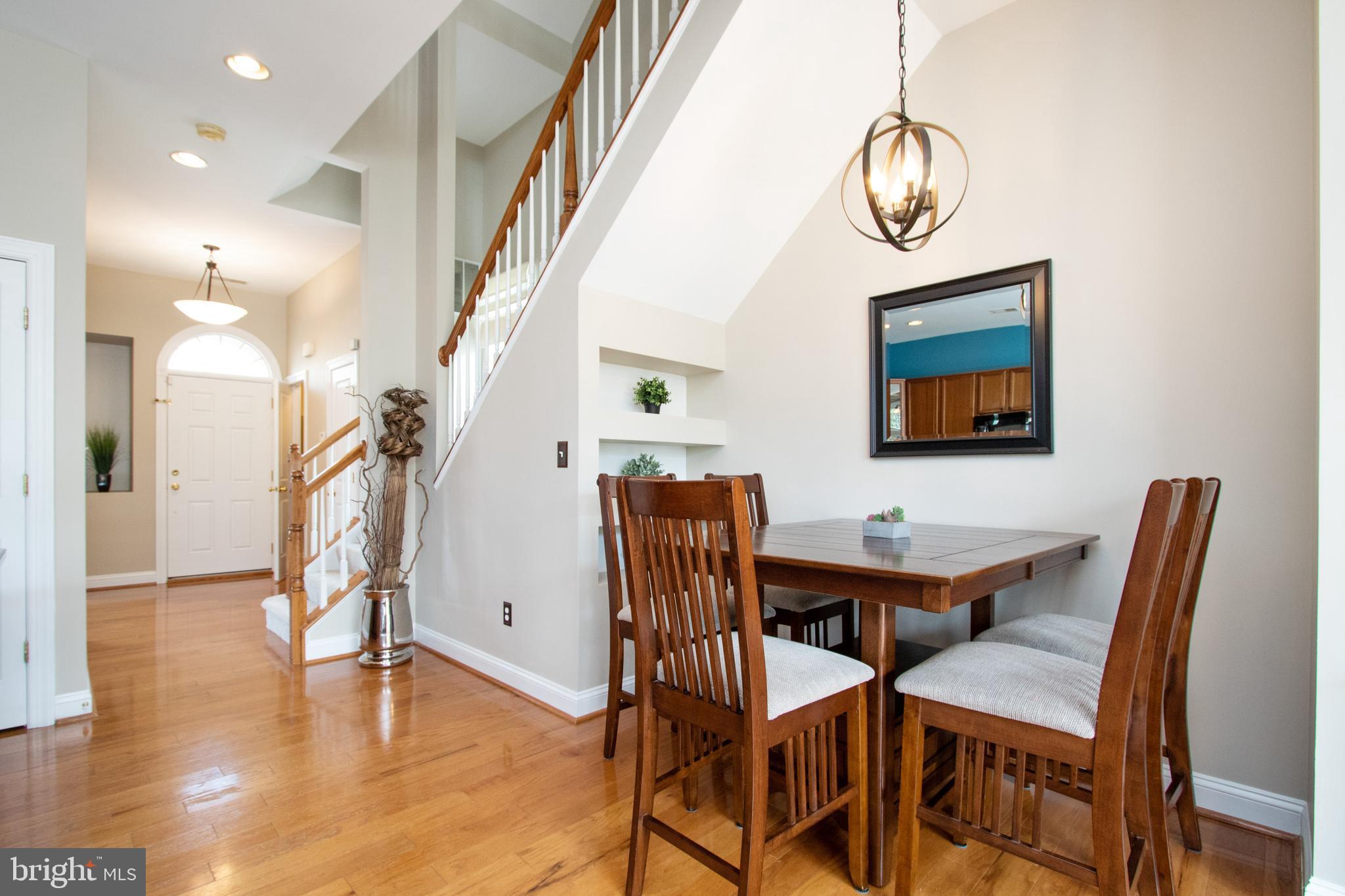9036 Ribbon Falls Loop Bristow, VA 20136 - Photo 14 of 43 Breakfast Area with Built-In Display Shelving
