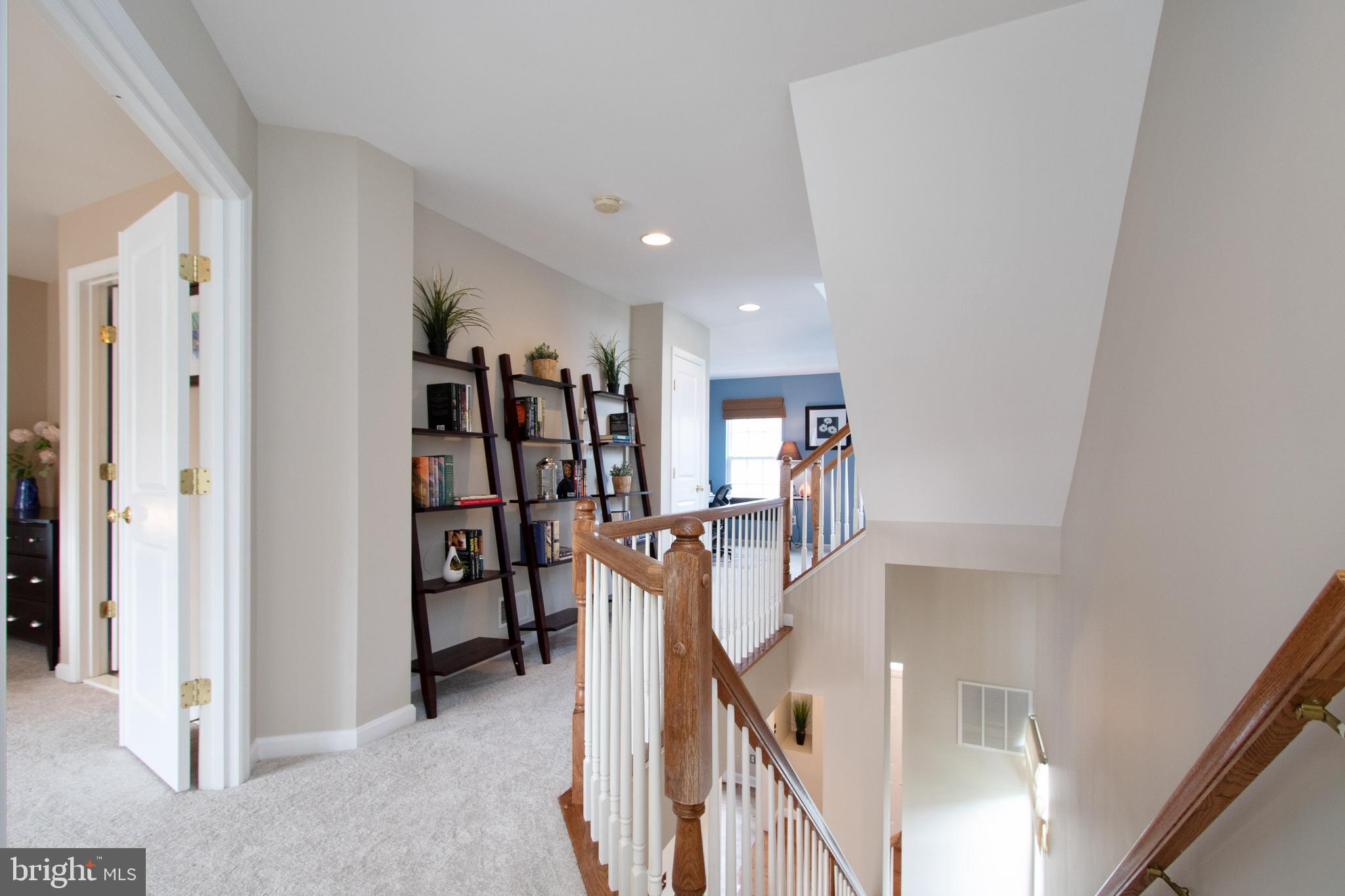 9036 Ribbon Falls Loop Bristow, VA 20136 - Photo 18 of 43 2nd Level Hall Opens to Master Bedroom Retreat