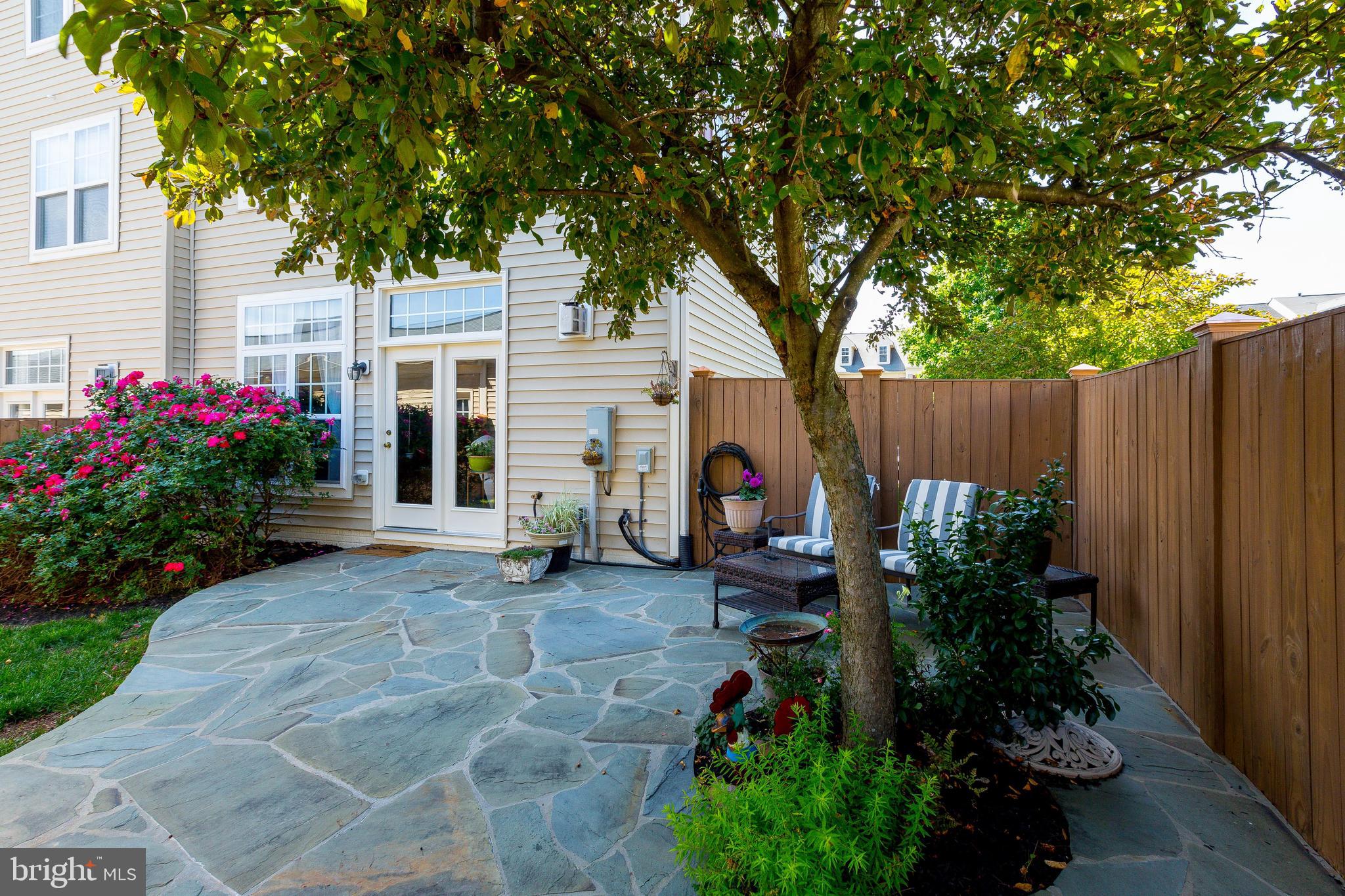 9036 Ribbon Falls Loop Bristow, VA 20136 - Photo 4 of 43 Backyard Retreat with Custom Flagstone Patio