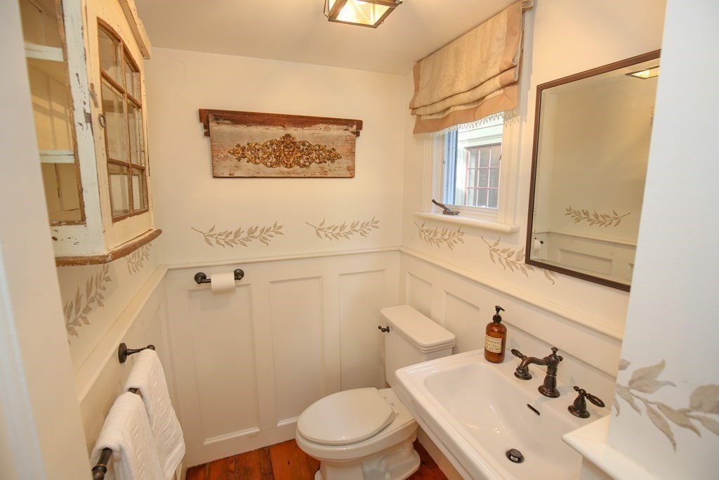 21 Rolfe's Lane Newbury, MA 01951 - Photo 13 of 42 a bathroom with a sink mirror and a toilet