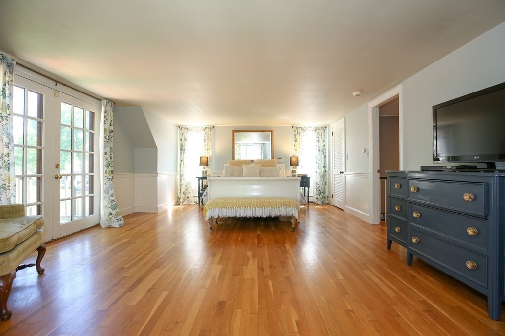 21 Rolfe's Lane Newbury, MA 01951 - Photo 17 of 42 a view of a living room hardwood and a kitchen with wooden floor
