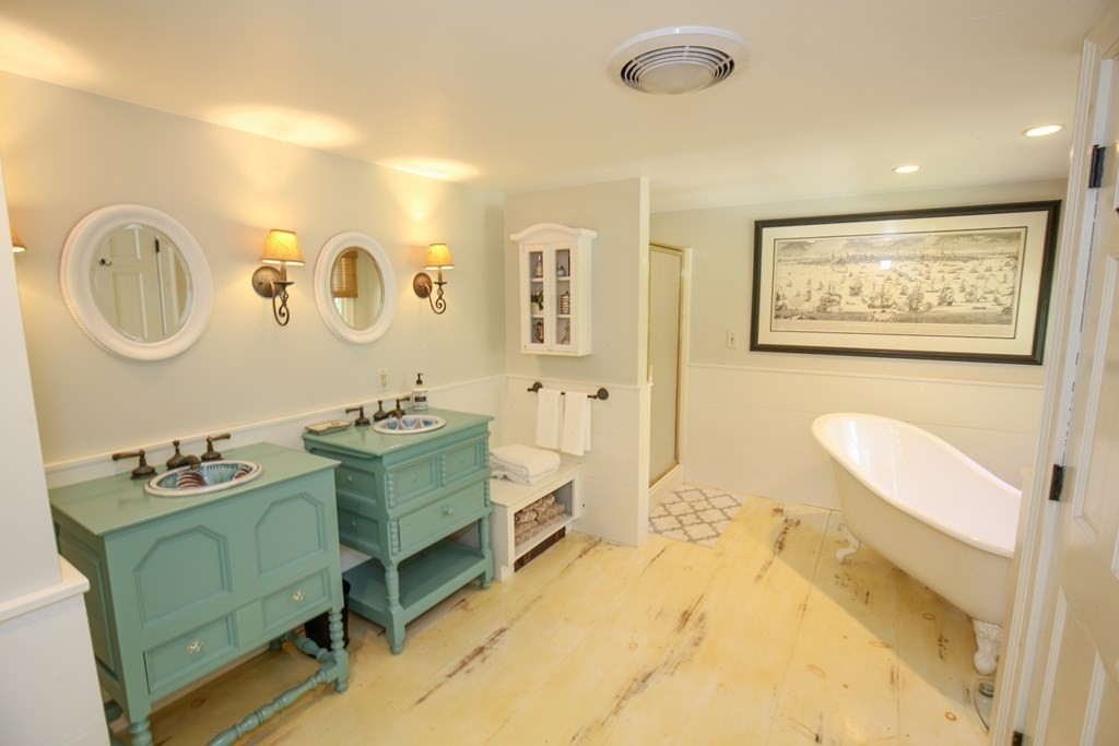 21 Rolfe's Lane Newbury, MA 01951 - Photo 18 of 42 a spacious bathroom with a mirror a sink and a mirror