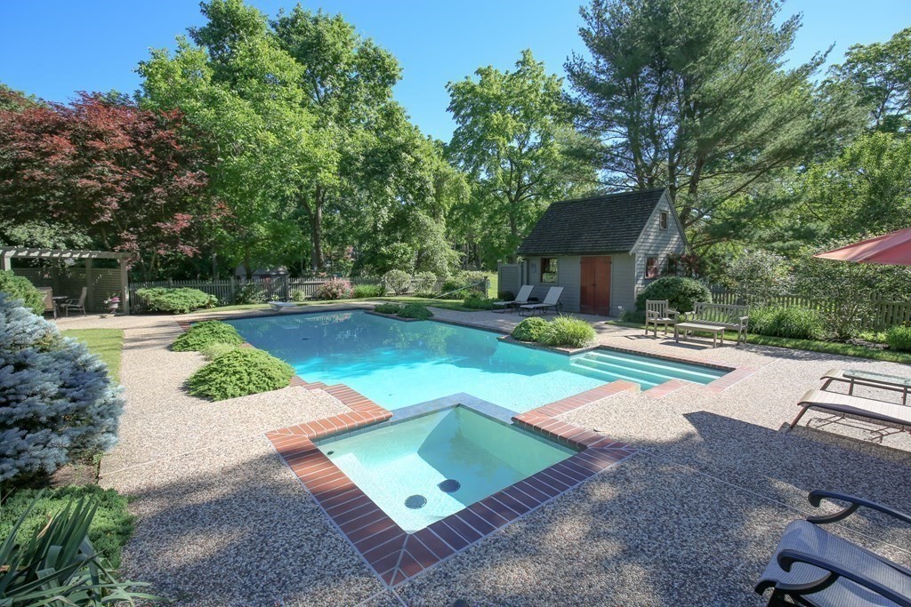 21 Rolfe's Lane Newbury, MA 01951 - Photo 31 of 42 a view of a backyard with lawn chairs and a large tree
