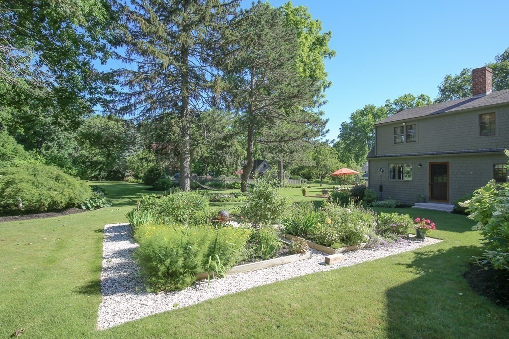 21 Rolfe's Lane Newbury, MA 01951 - Photo 36 of 42 a view of a garden with large trees