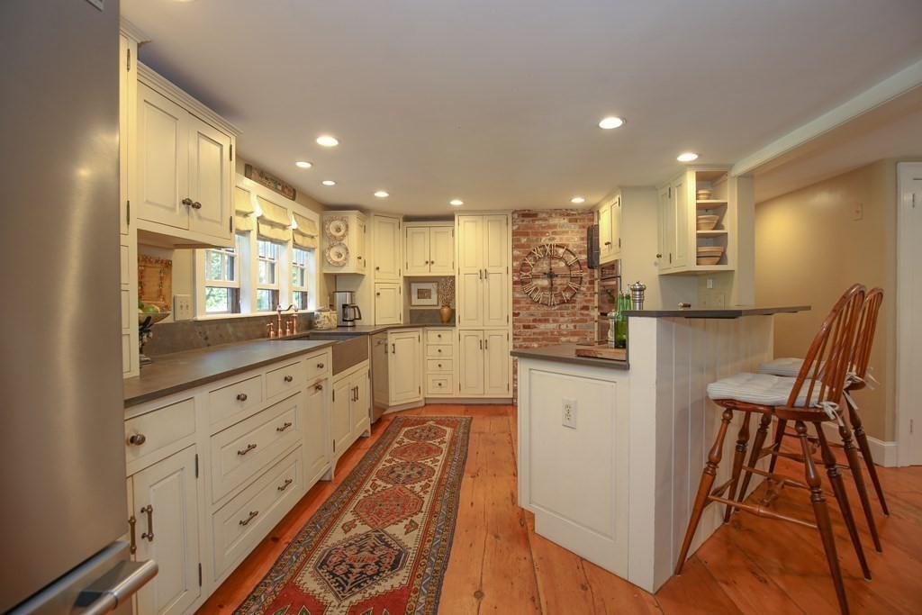 21 Rolfe's Lane Newbury, MA 01951 - Photo 4 of 42 a kitchen with counter top space cabinets and stainless steel appliances