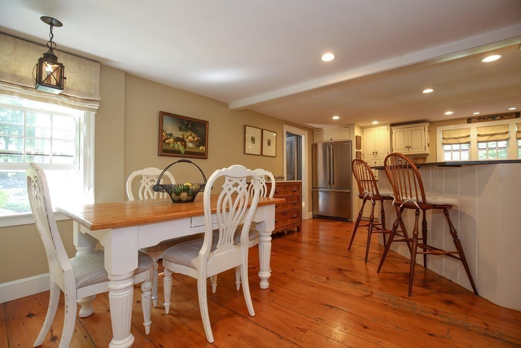 21 Rolfe's Lane Newbury, MA 01951 - Photo 5 of 42 a view of a dining room with furniture and wooden floor