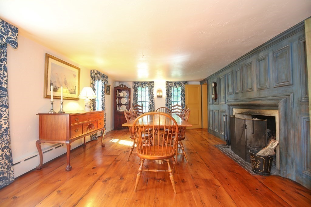 21 Rolfe's Lane Newbury, MA 01951 - Photo 6 of 42 a living room with fireplace furniture and a wooden floor