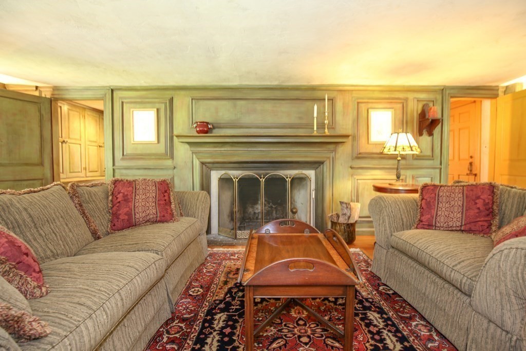 21 Rolfe's Lane Newbury, MA 01951 - Photo 8 of 42 a living room with furniture and a fireplace