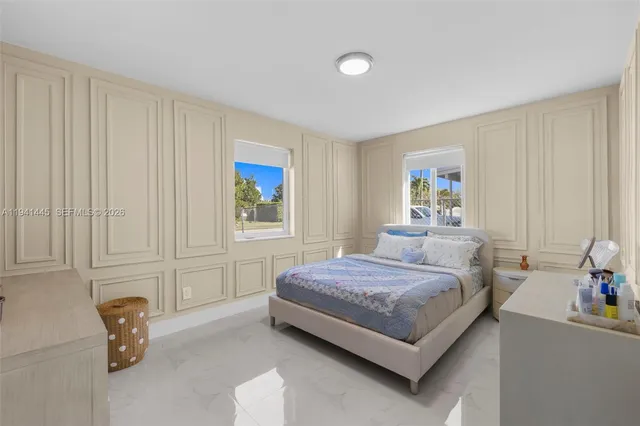 a bedroom with a bed and furniture