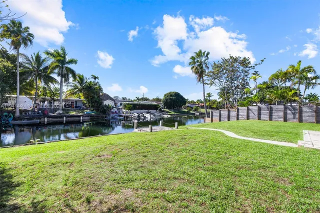 a view of a lake with a house in the background