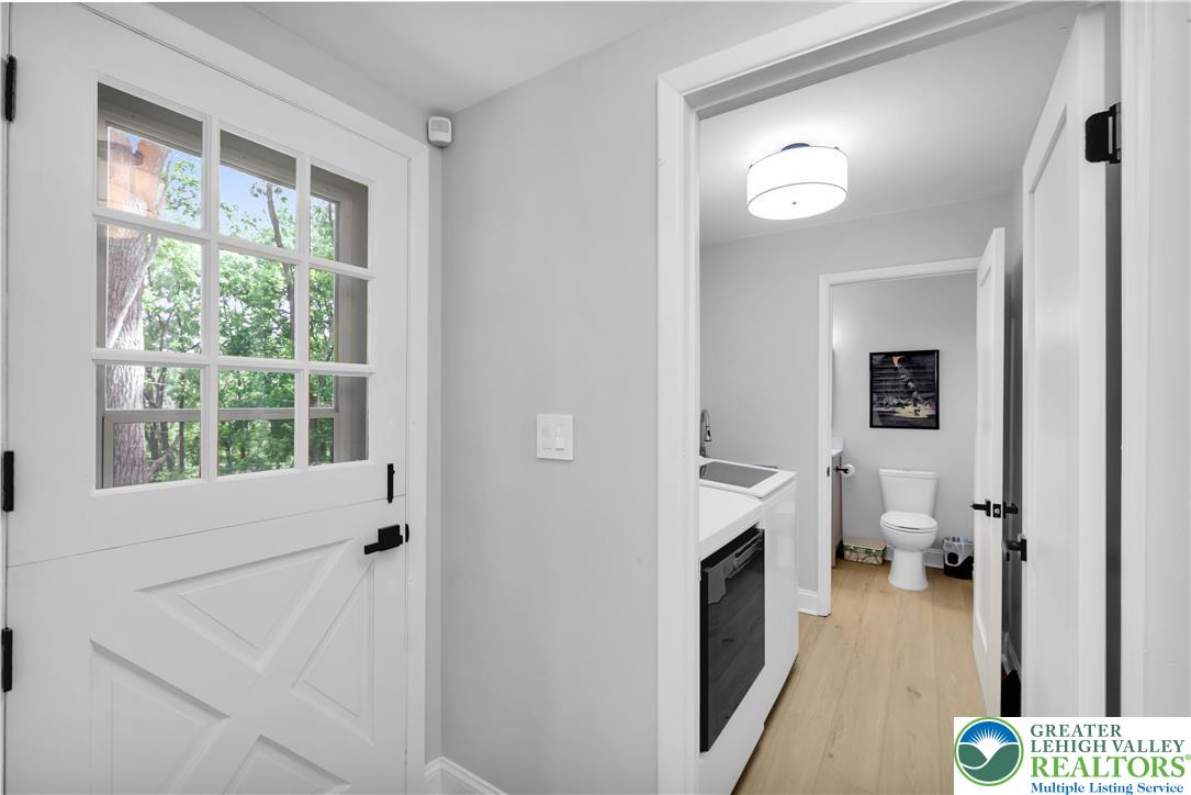 2011 Greenwood Road Allentown, PA 18103 - Photo 19 of 52 A classic white Dutch door opens to an airy interior with light-toned flooring.