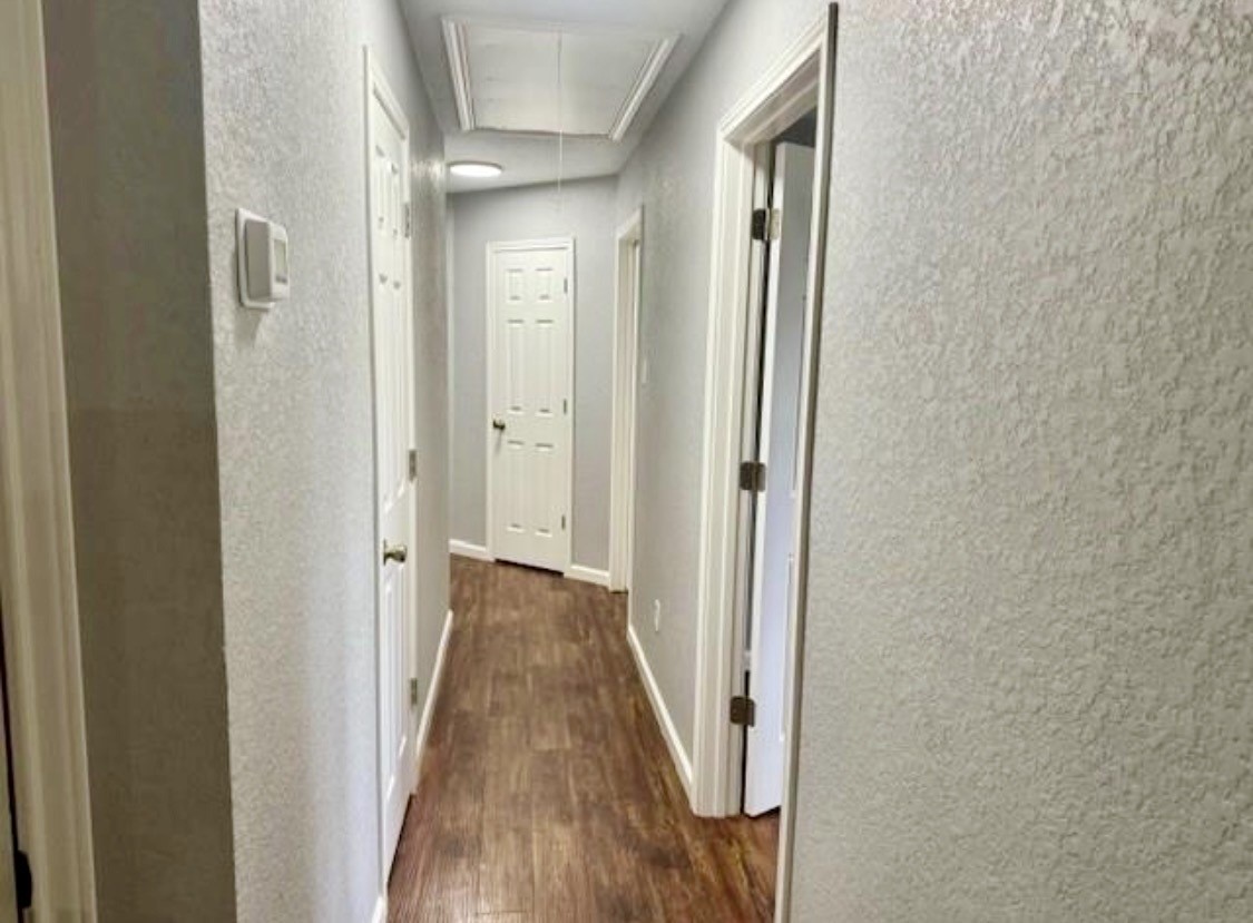 327 County Road 735 Angleton, TX 77515 - Photo 14 of 39 a view of a hallway with wooden floor and staircase