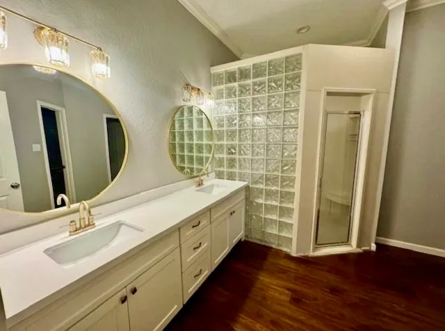 a bathroom with a double vanity sink and a mirror
