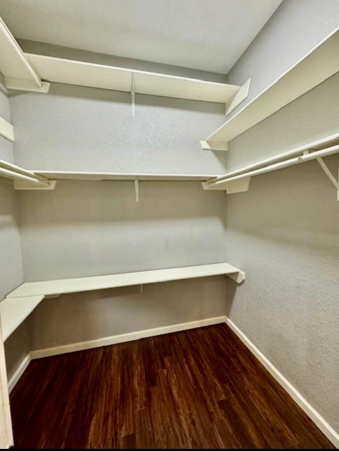 327 County Road 735 Angleton, TX 77515 - Photo 19 of 39 a view of storage and utility room with wooden floor