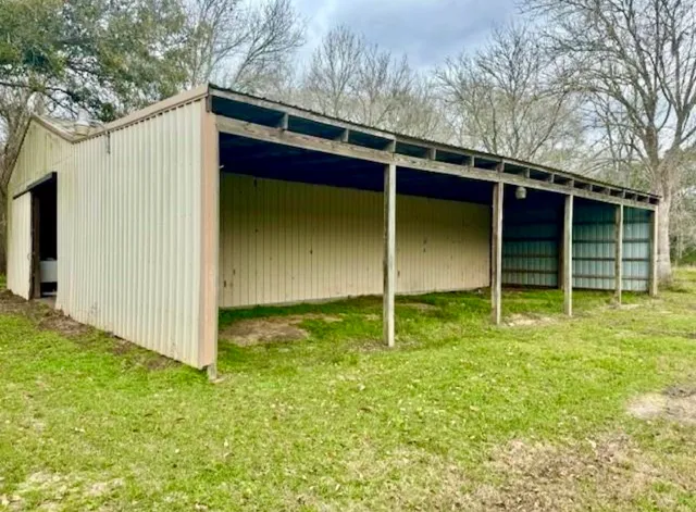 a view of a big yard with an trees