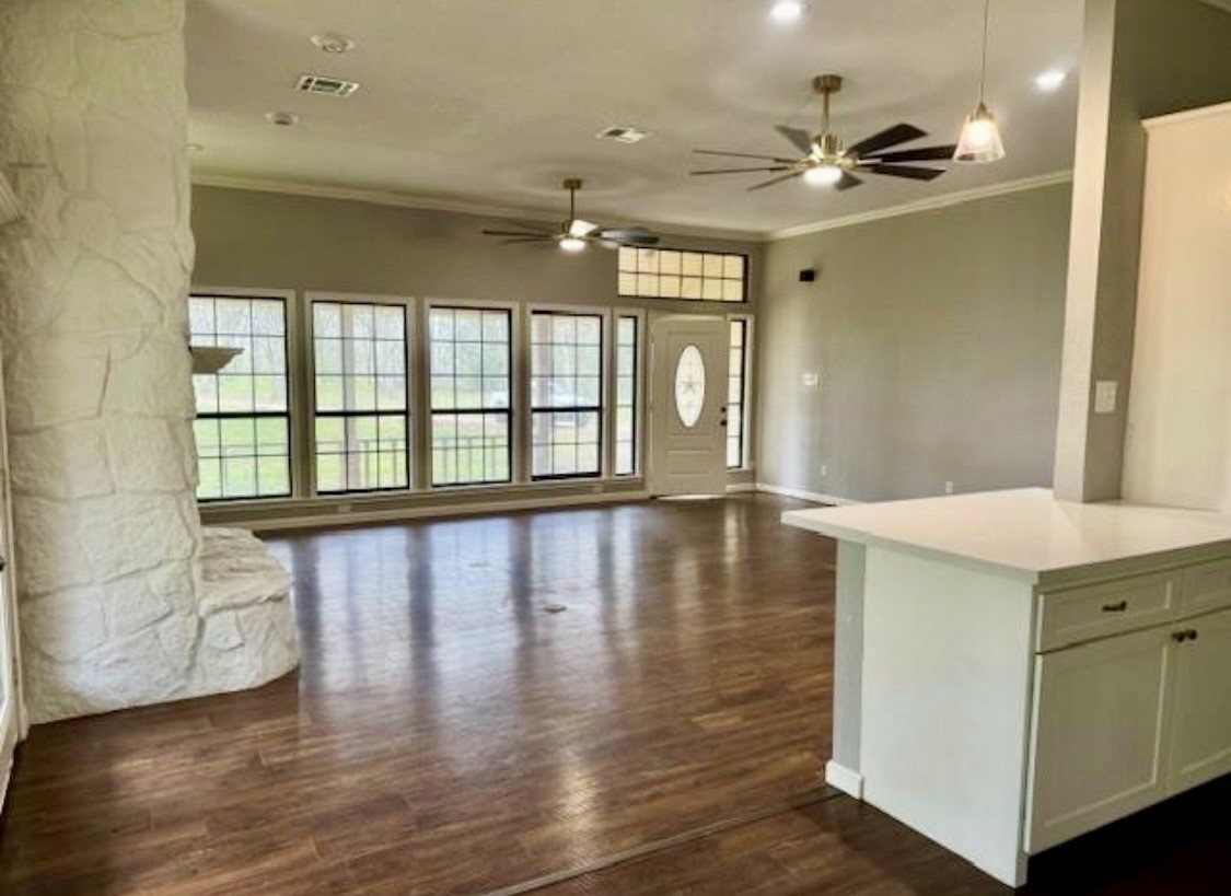 327 County Road 735 Angleton, TX 77515 - Photo 6 of 39 a view of a livingroom with furniture wooden floor and a window