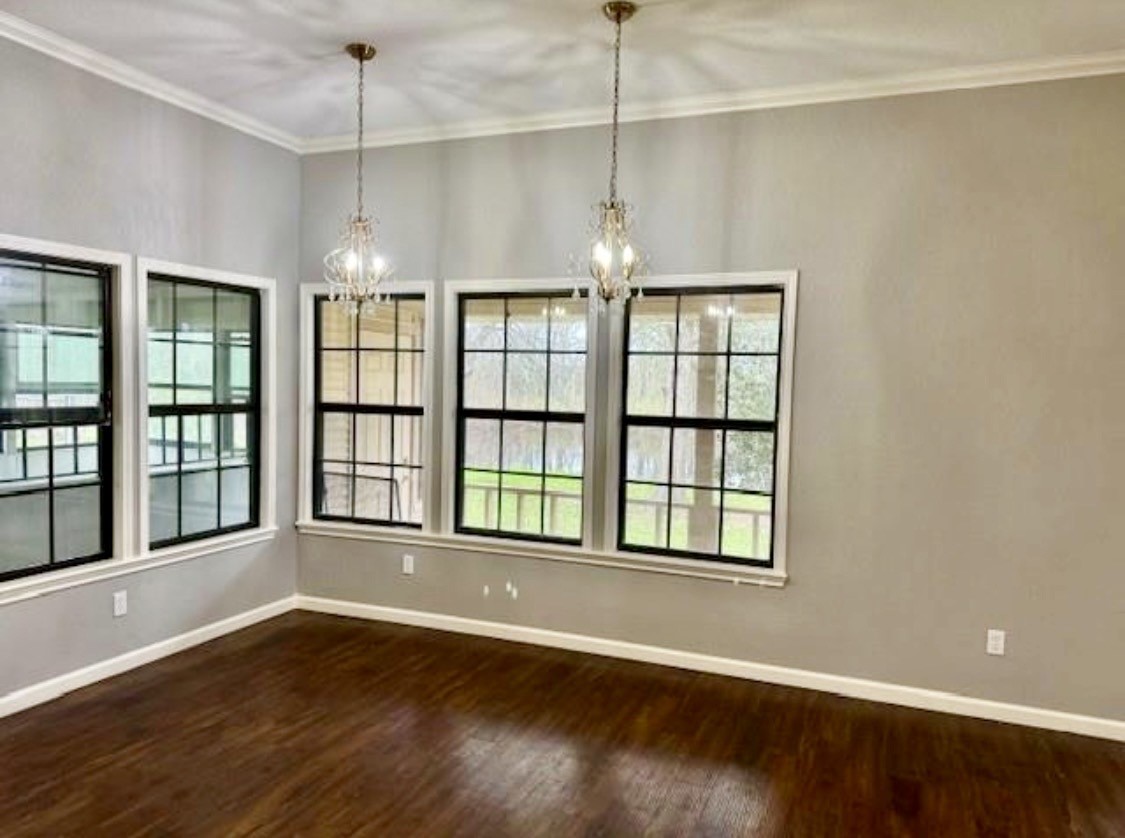 327 County Road 735 Angleton, TX 77515 - Photo 10 of 39 a view of an empty room with wooden floor and a window