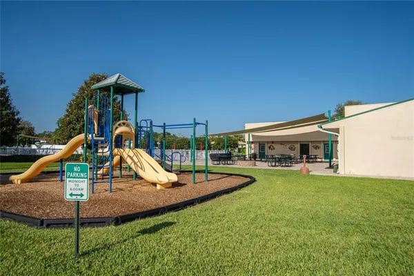 a view of a house with swimming pool and porch