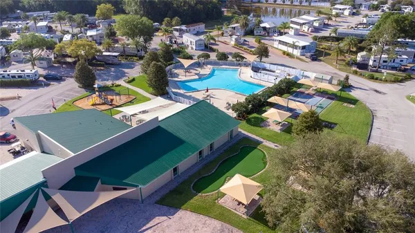 an aerial view of a house with garden space and street view