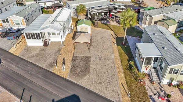 an aerial view of a house with a swimming pool